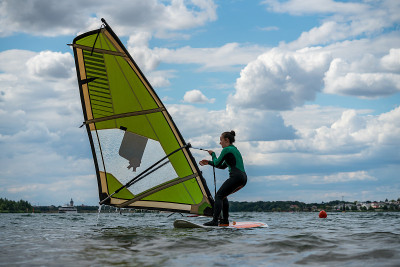 Woman learning how to windsurf