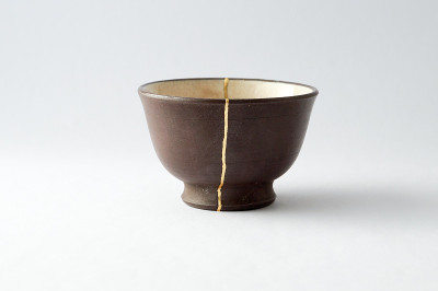 Antique broken Japanese cup repaired with gold kin