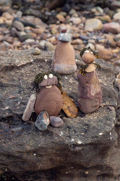 Trio of miniature rock people