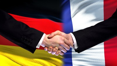 德国与法国握手，标志着国际友好关系的背景