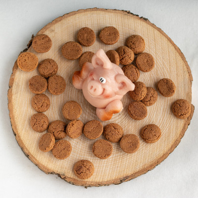 Marzipan pig with many pepernoten cookies