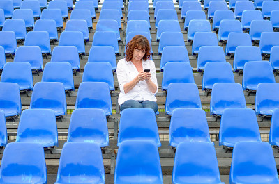 Lone middle-aged woman in a stands
