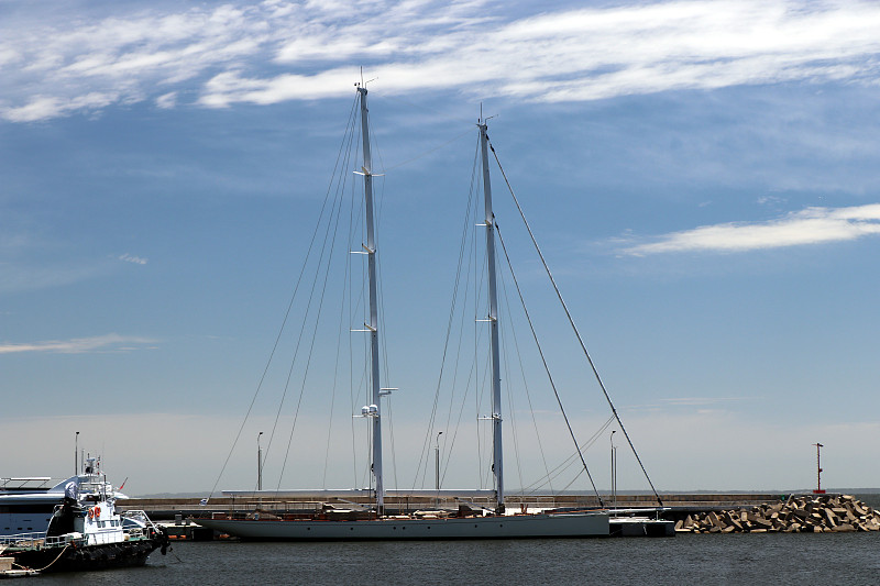 Boats moored at the yacht club pier