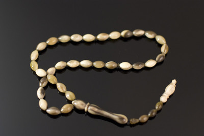 Muslim prayer beads of animal horn on black