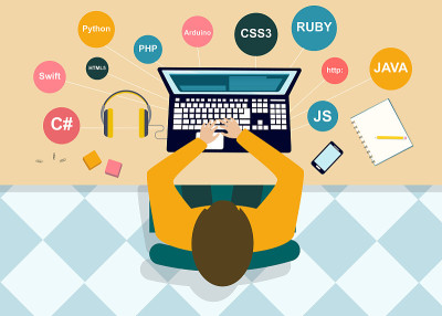 Top view of programmer working on laptop, creative