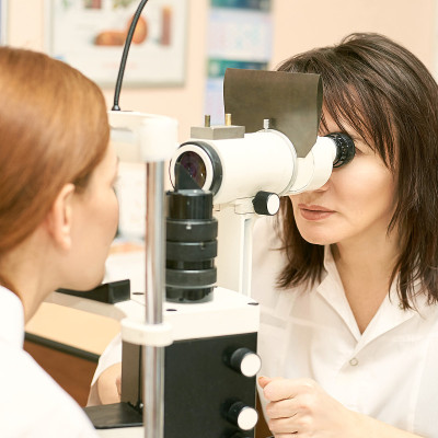 ophthalmologist doctor in exam optician laboratory