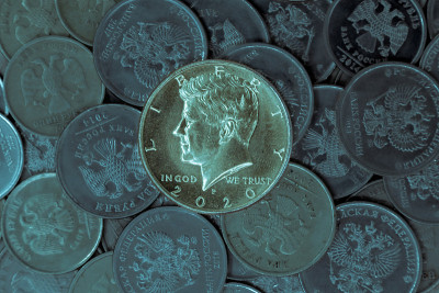Half dollar coin on the background of Russian rubl