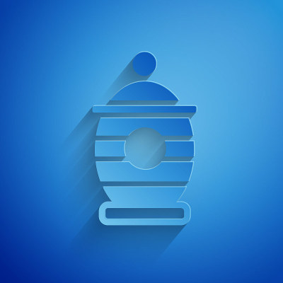 Paper cut Funeral urn icon isolated on blue backgr