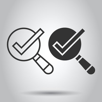 Check mark with magnifying glass icon in flat styl