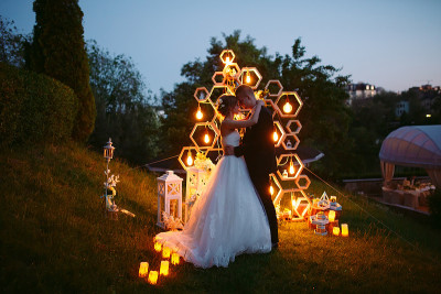 Evening wedding ceremony. The bride and Groom are 