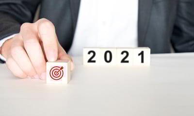Hand holding wood cubes with New year 2021 and goa