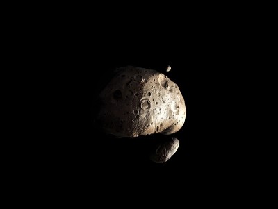 黑色背景上有两颗卫星的大型小行星。