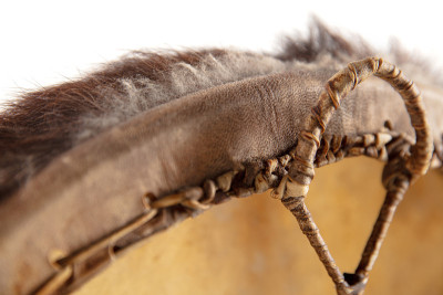 A close up of hands playing the tambourine, percus