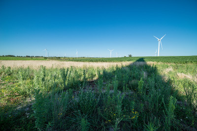 Shadow of a modern wind mill on the countyside nea