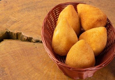 Croquette stuffed with chicken, drumstick, on wood