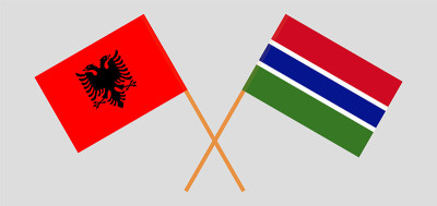 Crossed flags of Albania and the Gambia