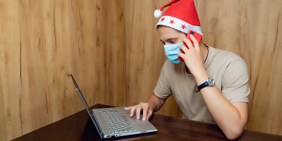Handsome man wear red Christmas Santa Claus cap wi