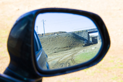 Car mirror reflection close-up, daylight and mirro