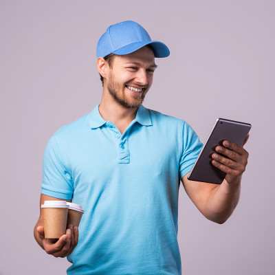 Delivery man is using tablet pc for navigation and