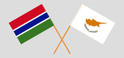 Crossed flags of Cyprus and the Gambia