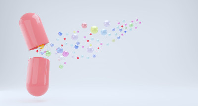 绿色胶囊富含胶原蛋白、维生素E和天然提取物。食品补充剂品牌概念白色孤立背景与复制空间3d渲染。