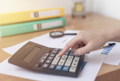female accountant or banker making calculations si