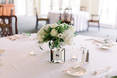 Close-up of a wedding reception table with salt an