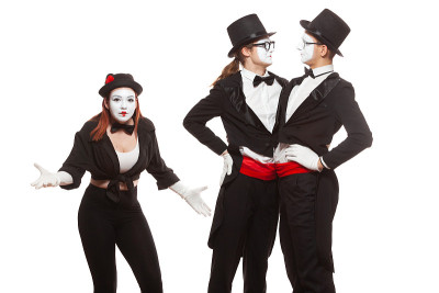 Portrait of three mime artists performing, isolate