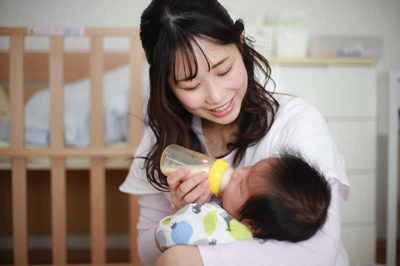 Mother feeding her baby