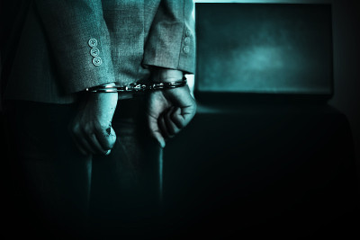 商人手戴手铐，犯罪概念逮捕