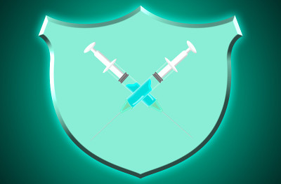 2支装满疫苗的注射器以X形重叠在一个浅绿色的保护罩上