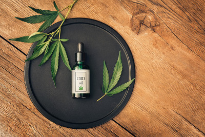 Cannabs medical product, CBD oil, with hemp leaves