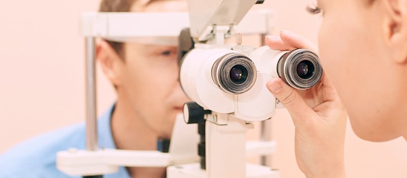 ophthalmologist doctor in exam optician laboratory