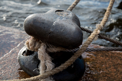 Mooring bollard rope harbor sea port closeup