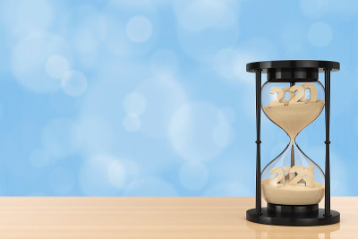 New 2021 Year Concept. Sand Falling in Hourglass T