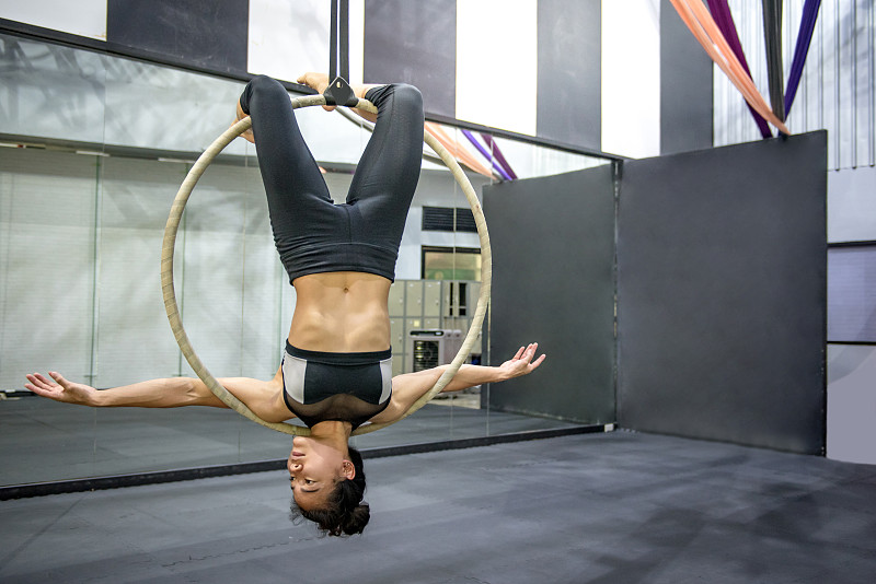 young asian acrobatic woman doing her gymnastics p