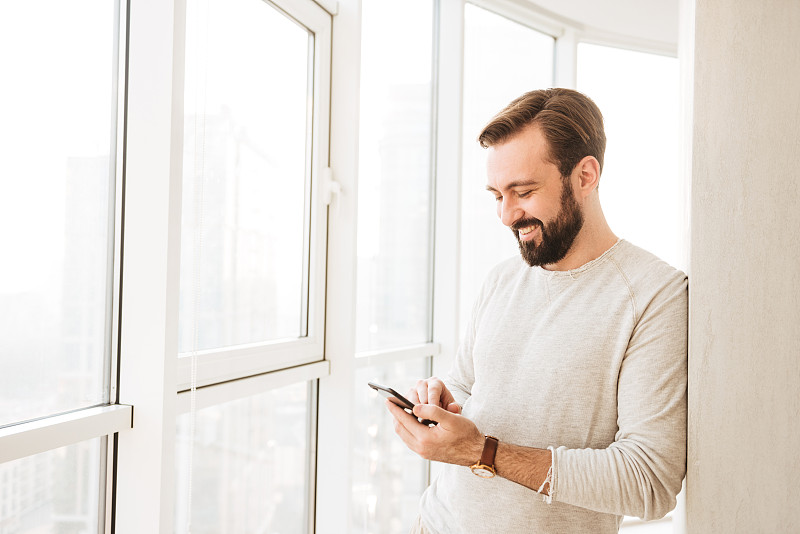 Photo of relaxed guy 30s having beard and mustache