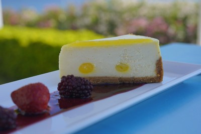 a slice of cake served with fruits