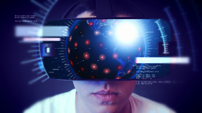 帅气的年轻人戴着VR头戴体验虚拟现实。