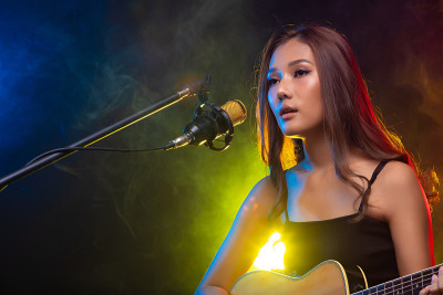 Teenager Woman sing song loudly power sound on Mic