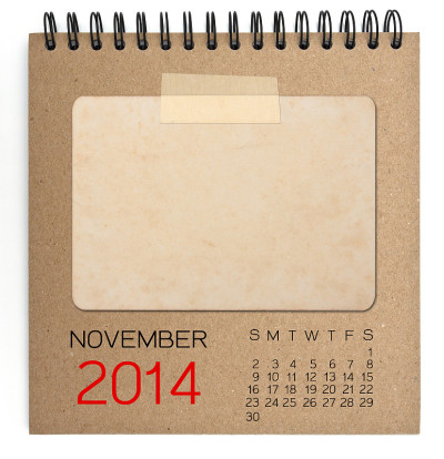 2014年11月日历棕色笔记本与旧空白照片