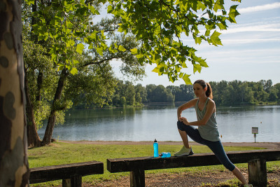A woman stretching in the park
