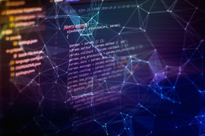 笔记本特写照片。CSS, JavaScript和HTML的使用。监控功能源代码的特写。摘要IT技术背