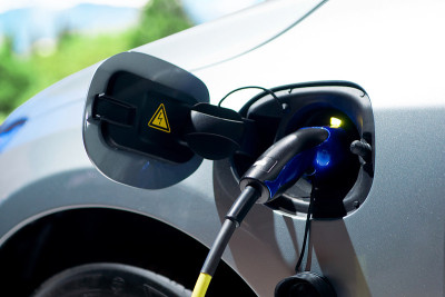 Electric car charging at station