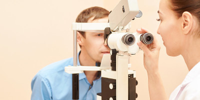 ophthalmologist doctor in exam optician laboratory