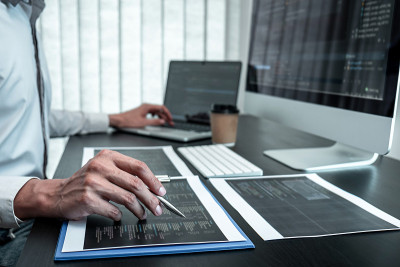 Developer programmer working on coding program sof