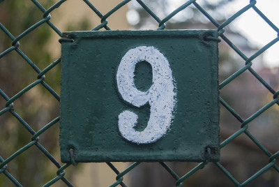 Old retro cast iron plate number 9