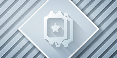 Paper cut Cinema ticket icon isolated on grey back