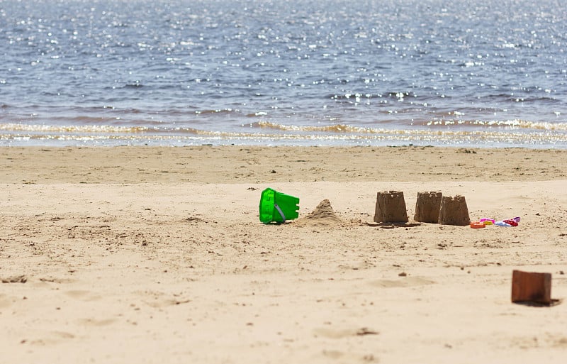 Sand forms figures castles made by child on sand b