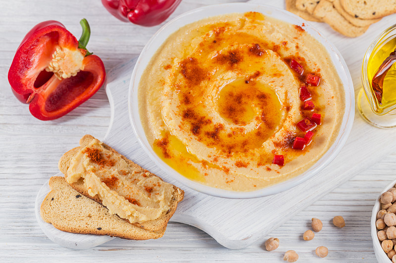 A bowl of chickpeas homemade hummus with olive oil